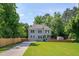 Charming two-story home featuring a manicured lawn, classic design, and inviting curb appeal at 3003 University Dr, Durham, NC 27707
