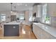 Modern kitchen with stainless appliances, kitchen island, and eat-in breakfast bar at 3003 University Dr, Durham, NC 27707