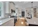 Elegant kitchen boasts stainless steel appliances, white cabinets, and a central island with seating at 3003 University Dr, Durham, NC 27707