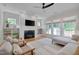 Cozy living room with a fireplace, built-in shelving, and natural light creates a relaxing atmosphere at 3003 University Dr, Durham, NC 27707