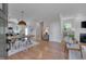 Open-concept living space seamlessly connects the kitchen, dining area, and cozy living room at 3003 University Dr, Durham, NC 27707