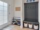 Functional mudroom entryway with coat rack, bench, and storage baskets at 3003 University Dr, Durham, NC 27707