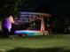 Amphitheater in Downtown Cary Park, featuring an outdoor stage, lawn seating, and colorful lighting at 3034 Winfred Dell Ln, Cary, NC 27511