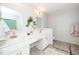 Bright bathroom featuring double sinks, updated fixtures and modern finishes at 3034 Winfred Dell Ln, Cary, NC 27511
