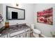 Charming bathroom with decorative mirror, modern sink, and eye-catching artwork at 3034 Winfred Dell Ln, Cary, NC 27511