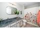 Well-lit bathroom with updated single sink vanity and shower with floral curtain at 3034 Winfred Dell Ln, Cary, NC 27511