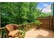 Outdoor deck with a view of the peaceful surrounding woods, perfect for enjoying nature at 3034 Winfred Dell Ln, Cary, NC 27511