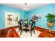 Cozy dining room features a round table, unique light fixture, and views of the outdoors at 3034 Winfred Dell Ln, Cary, NC 27511