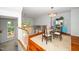 Charming dining area showcasing a glass table, decorative furnishings, and hardwood floors at 3034 Winfred Dell Ln, Cary, NC 27511