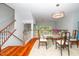 Bright dining room with a unique chandelier and a glass table at 3034 Winfred Dell Ln, Cary, NC 27511