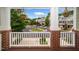 View from front porch with brick pillars of neighborhood street and townhomes at 3034 Winfred Dell Ln, Cary, NC 27511