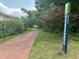 Scenic brick path along the Greenway trail, surrounded by lush greenery and trees in a peaceful setting at 3034 Winfred Dell Ln, Cary, NC 27511