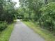 Picturesque Greenway trail surrounded by lush greenery, creating a serene and natural environment at 3034 Winfred Dell Ln, Cary, NC 27511