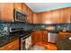Well-equipped kitchen featuring stainless steel appliances and granite countertops at 3034 Winfred Dell Ln, Cary, NC 27511