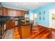 Stylish kitchen featuring an island, stainless steel appliances, and vibrant blue walls at 3034 Winfred Dell Ln, Cary, NC 27511