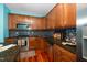 Functional kitchen equipped with stainless steel appliances, ample cabinetry, and granite countertops at 3034 Winfred Dell Ln, Cary, NC 27511
