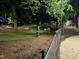 Park featuring lush green spaces, mature trees, and accessible pathways for outdoor enjoyment at 3034 Winfred Dell Ln, Cary, NC 27511