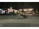 Restaurant exterior featuring outdoor seating with string lights, set near a parking area at 3034 Winfred Dell Ln, Cary, NC 27511
