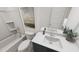 Stylish bathroom with a single sink vanity and a shower-tub combination with neutral color palette at 309 Beacon Dr, Pittsboro, NC 27312