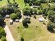 Aerial view of the property showing the home, outbuildings and surrounding acreage at 319 Knox Rd, Gibsonville, NC 27249