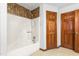 Full bathroom with a bathtub and two doors that offer multiple access points at 319 Knox Rd, Gibsonville, NC 27249