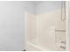 Minimalist bathroom featuring a bathtub and shower with basic fixtures and simple design elements at 319 Knox Rd, Gibsonville, NC 27249