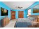 Bedroom featuring a wooden bed, ceiling fan, ample storage, natural light, and a comfortable ambiance at 319 Knox Rd, Gibsonville, NC 27249