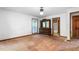 Spacious bedroom with a dresser and a window, with the flooring waiting for the next design choice at 319 Knox Rd, Gibsonville, NC 27249