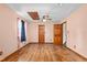 Bedroom featuring hardwood floors, ceiling fan, doors to other rooms, and an airy feel at 319 Knox Rd, Gibsonville, NC 27249