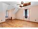 Bright bedroom featuring hardwood floors, a ceiling fan, and ample natural light, creating a welcoming atmosphere at 319 Knox Rd, Gibsonville, NC 27249