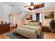 Charming bedroom with hardwood floors, ceiling fan, comfortable furnishings, and a soft, inviting ambiance at 319 Knox Rd, Gibsonville, NC 27249