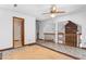 Second story space with a view of a brick wall, a banister, and a ceiling fan at 319 Knox Rd, Gibsonville, NC 27249
