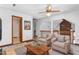Room with two armchairs and a table, plus a hallway leading to another room with a full bathroom at 319 Knox Rd, Gibsonville, NC 27249