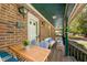 Inviting front porch with outdoor seating, lighting, and view of the front yard at 319 Knox Rd, Gibsonville, NC 27249