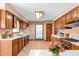 Bright kitchen with wood cabinets, white countertops, and ample counter space at 319 Knox Rd, Gibsonville, NC 27249