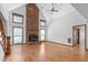 Bright, airy living room features a stunning brick fireplace and neutral tones at 319 Knox Rd, Gibsonville, NC 27249