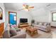Cozy upstairs living area with comfortable seating, a ceiling fan, and a television for relaxation at 319 Knox Rd, Gibsonville, NC 27249