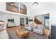 Spacious living room with tall ceilings, lots of natural light, and hardwood floors at 319 Knox Rd, Gibsonville, NC 27249
