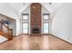 Bright living room features a stunning brick fireplace and neutral tones at 319 Knox Rd, Gibsonville, NC 27249