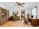 Charming home office featuring hardwood floors, built-in shelving, and a tranquil workspace at 319 Knox Rd, Gibsonville, NC 27249