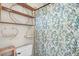 Cozy bathroom design featuring round, floating shelves and a decorative shower curtain at 3325 Falls River Ave, Raleigh, NC 27614