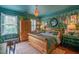 Unique bedroom featuring playful wallpaper, natural light, and hardwood floors at 3325 Falls River Ave, Raleigh, NC 27614