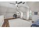 Spacious bedroom featuring neutral walls, a modern ceiling fan, and a desk area for added functionality at 3325 Falls River Ave, Raleigh, NC 27614