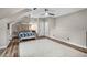 Bedroom featuring neutral walls, hardwood floors, a rug, and a ceiling fan, creating a peaceful retreat at 3325 Falls River Ave, Raleigh, NC 27614