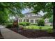 Exterior of the clubhouse with manicured landscaping and ample parking at 3325 Falls River Ave, Raleigh, NC 27614