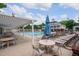 Relaxing community pool area with lounge chairs, tables, and a pergola, creating an inviting outdoor space at 3325 Falls River Ave, Raleigh, NC 27614