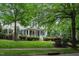 Charming two-story home with black shutters, front porch and professionally landscaped yard at 3325 Falls River Ave, Raleigh, NC 27614