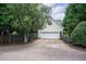 Exterior image of the home's garage, driveway, and tidy landscaping at 3325 Falls River Ave, Raleigh, NC 27614