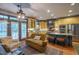 Well-appointed kitchen with an island, seating, custom cabinets, and seamless access to the living area at 3325 Falls River Ave, Raleigh, NC 27614