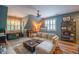 Inviting living room with natural light, comfortable seating, and hardwood floors at 3325 Falls River Ave, Raleigh, NC 27614